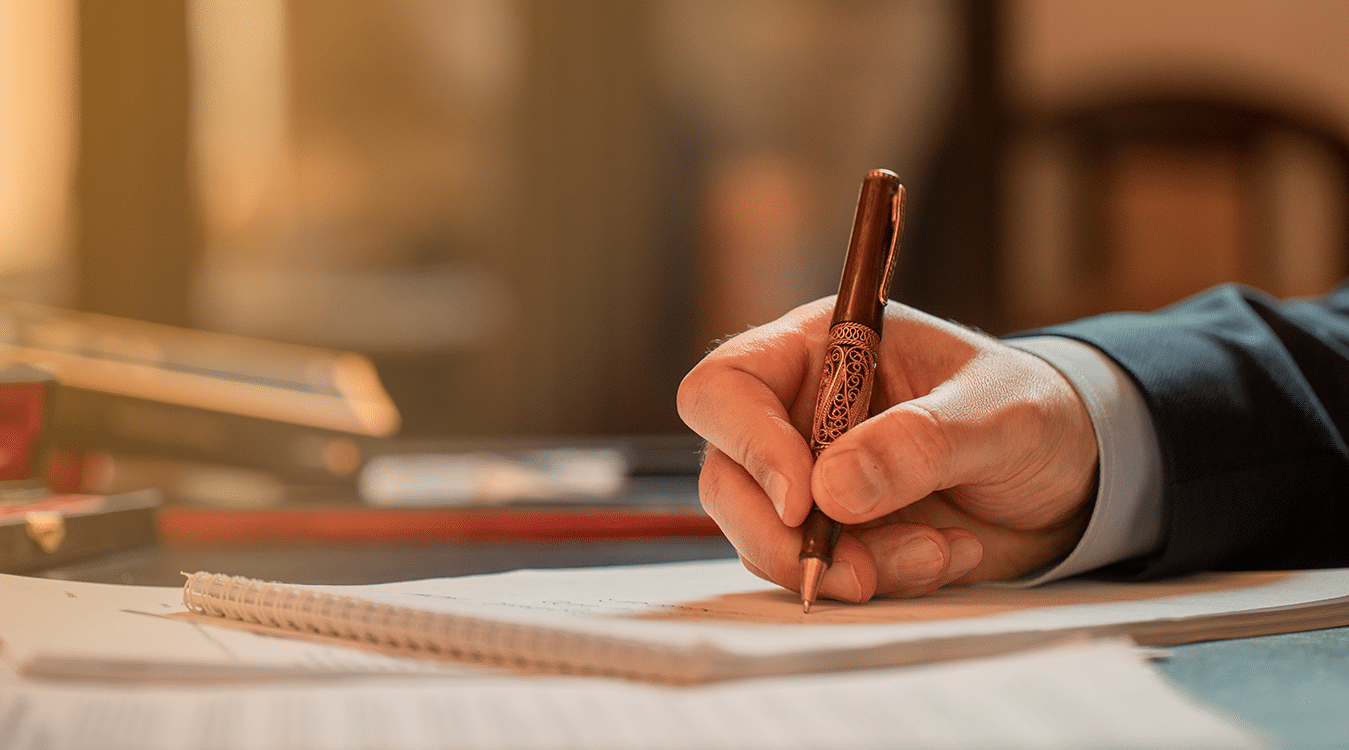 Writing by hand on paper